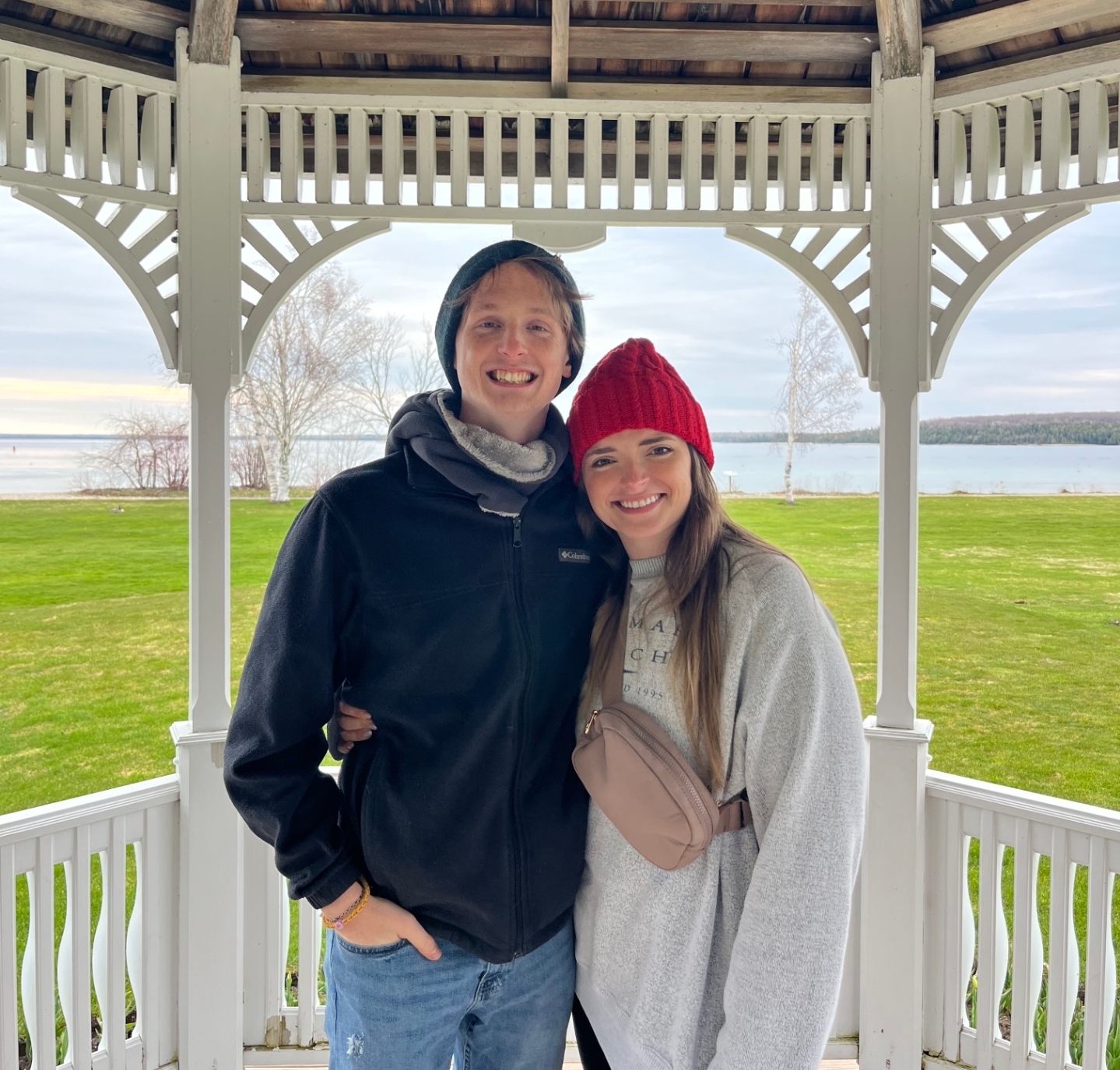Hannah and Lucas together beneath a lakeside gazebo